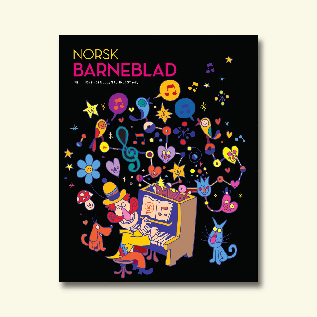 Norsk Barneblad, nr. 11 november 2025, framside om musikk med ein fargerik illustrasjon av ein mann som spelar piano omgitt av notar, stjerner og dyr på svart bakgrunn